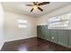 Bedroom with dark wood floors and green wainscoting at 3709 W Oklahoma Ave, Tampa, FL 33611