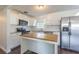 Modern kitchen with white shaker cabinets and granite countertops at 3709 W Oklahoma Ave, Tampa, FL 33611