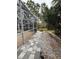 Landscaped backyard with stone pathway at 3830 Stornoway Dr, Land O Lakes, FL 34638