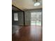 Dining room with pool view and wood-look tile flooring at 3830 Stornoway Dr, Land O Lakes, FL 34638