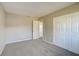 Spacious bedroom with neutral carpeting and double door closet at 4173 Driver Ln, Port Charlotte, FL 33981