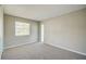 Well-lit bedroom with neutral walls, carpet, and a window at 4173 Driver Ln, Port Charlotte, FL 33981