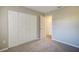 Spacious bedroom with neutral walls, carpet and double door closet at 4173 Driver Ln, Port Charlotte, FL 33981