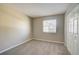 Cozy bedroom with neutral walls, carpet, and a window at 4173 Driver Ln, Port Charlotte, FL 33981