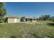 House exterior with screened porch and yard at 4173 Driver Ln, Port Charlotte, FL 33981