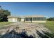 House exterior with screened porch and yard at 4173 Driver Ln, Port Charlotte, FL 33981