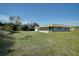 House exterior with screened porch and yard at 4173 Driver Ln, Port Charlotte, FL 33981