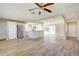 Open living room and kitchen with wood-look flooring and island at 4173 Driver Ln, Port Charlotte, FL 33981