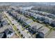 Aerial view of a house with a backyard, driveway and two-car garage at 4456 Tubular Run, Land O Lakes, FL 34638