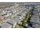 Aerial view showcasing a two-story house and its backyard at 4456 Tubular Run, Land O Lakes, FL 34638