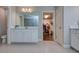 Bathroom featuring a large vanity and walk-in closet at 4456 Tubular Run, Land O Lakes, FL 34638