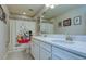 ' bathroom with Mickey Mouse shower curtain and double sinks at 4456 Tubular Run, Land O Lakes, FL 34638