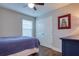 Bedroom with double door closet and wood flooring at 4456 Tubular Run, Land O Lakes, FL 34638