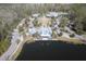 Community clubhouse and pool area with a lake view at 4456 Tubular Run, Land O Lakes, FL 34638