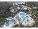 Aerial view of community pool area with expansive deck and lounge chairs at 4456 Tubular Run, Land O Lakes, FL 34638