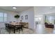 Bright dining room with a rustic wooden table and modern chairs at 4456 Tubular Run, Land O Lakes, FL 34638