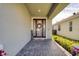 Inviting front entry with brick walkway, decorative wreath, and welcome sign at 4456 Tubular Run, Land O Lakes, FL 34638