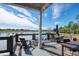 Relaxing lakefront deck with seating and tables, perfect for outdoor entertaining at 4456 Tubular Run, Land O Lakes, FL 34638