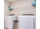 Laundry room with washer, dryer, and overhead shelving at 4456 Tubular Run, Land O Lakes, FL 34638