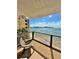 Relaxing balcony overlooking the water with comfortable seating at 450 S Gulfview Blvd # 408, Clearwater Beach, FL 33767