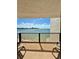 Balcony with stunning water views and two chairs at 450 S Gulfview Blvd # 408, Clearwater Beach, FL 33767