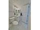 Clean bathroom with white cabinets and hexagon tile floor at 450 S Gulfview Blvd # 408, Clearwater Beach, FL 33767