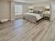 Spacious Primary bedroom with wood-look flooring at 450 S Gulfview Blvd # 408, Clearwater Beach, FL 33767