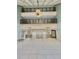 Spacious lobby with high ceilings, elevators, and tiled floors at 450 S Gulfview Blvd # 408, Clearwater Beach, FL 33767