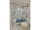 Updated shower with marble tile, glass enclosure, and built-in seat at 450 S Gulfview Blvd # 408, Clearwater Beach, FL 33767