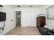 Bedroom with wood-look floors, closet, and dresser at 4520 N Matanzas Ave, Tampa, FL 33614