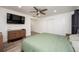 Primary bedroom featuring a large closet and TV at 4520 N Matanzas Ave, Tampa, FL 33614