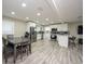 Bright dining area with gray table and chairs, adjacent to kitchen at 4520 N Matanzas Ave, Tampa, FL 33614