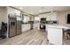 Open concept kitchen with island, stainless steel appliances, and white cabinets at 4520 N Matanzas Ave, Tampa, FL 33614