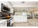 Modern kitchen with white cabinetry and stainless steel appliances at 4520 N Matanzas Ave, Tampa, FL 33614