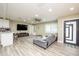 Open living area with gray sectional sofa and modern decor at 4520 N Matanzas Ave, Tampa, FL 33614