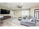 Living room with sectional sofa and large TV at 4520 N Matanzas Ave, Tampa, FL 33614