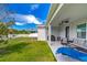 Relaxing covered patio with seating and a grill at 5027 Autumn Ridge Dr, Wesley Chapel, FL 33545