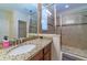 Bathroom with granite vanity, large shower, and mirrored medicine cabinet at 5027 Autumn Ridge Dr, Wesley Chapel, FL 33545