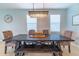 Elegant dining room features a large table, bench, and chandelier at 5027 Autumn Ridge Dr, Wesley Chapel, FL 33545