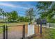 Fenced dog park with benches and rules posted at 5027 Autumn Ridge Dr, Wesley Chapel, FL 33545