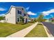 Two-story house with gray siding and landscaping at 5027 Autumn Ridge Dr, Wesley Chapel, FL 33545