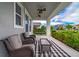 Relaxing front porch with seating and a ceiling fan at 5027 Autumn Ridge Dr, Wesley Chapel, FL 33545