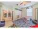 Playroom with colorful rug, toys, and built in storage at 5027 Autumn Ridge Dr, Wesley Chapel, FL 33545