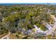 Aerial view showing home, pool, and lush landscaping at 5027 Sunrise S Dr, St Petersburg, FL 33705