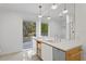 Modern bathroom with double vanity, terrazzo floor, and walk-in shower at 5027 Sunrise S Dr, St Petersburg, FL 33705