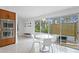 Bright breakfast nook with white table and chairs at 5027 Sunrise S Dr, St Petersburg, FL 33705