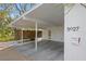 Covered carport with wood screen offering shade and privacy at 5027 Sunrise S Dr, St Petersburg, FL 33705