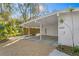 Covered carport with wood screen offering shade and privacy at 5027 Sunrise S Dr, St Petersburg, FL 33705