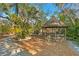 Screened gazebo offering a peaceful retreat in the backyard at 5027 Sunrise S Dr, St Petersburg, FL 33705