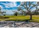 Scenic waterfront view with lush green space at 5027 Sunrise S Dr, St Petersburg, FL 33705